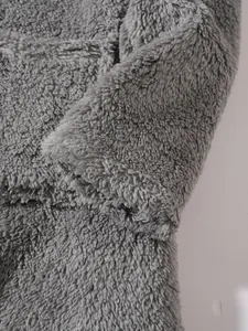 Detailed texture of a grey plush long-sleeved casual sweatshirt for women