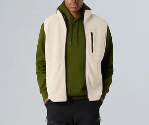 Close-up detail of cream sherpa fleece vest with stand collar for outdoor wear