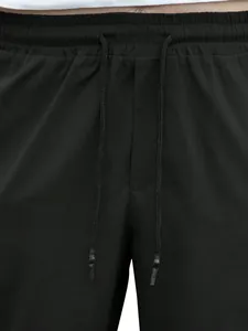 Detailed view of black elastic waistband featuring matching adjustable drawstrings.