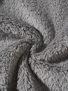 Detailed macro view of soft grey fuzzy fleece fabric texture for sweatshirt