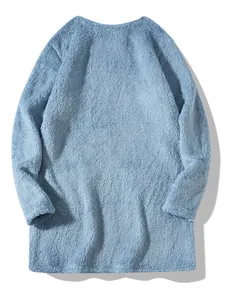 Detailed macro view of light blue fuzzy plush long sleeve crewneck sweatshirt for women
