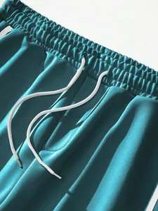 Close-up of elastic waistband and drawstring on teal vintage high street casual pants