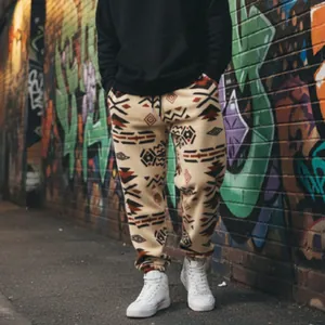 Detail of men's ethnic pattern fleece joggers with drawstring waist in urban setting