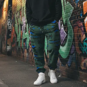 Detailed view of green fleece joggers featuring ethnic patterns and cuffed rib ankles