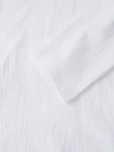 Detail showing the breathable linen fabric texture and sleeve cuff of men's casual shirt