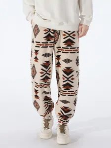 Macro view of men's warm tribal pattern sherpa joggers with elastic cuffs and drawstring