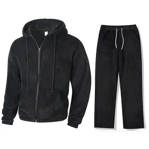 Detailed view of black plush fleece two-piece tracksuit featuring zip hoodie and drawstring pants