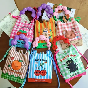 A variety of colorful mini cartoon crossbody bags featuring animal and fruit prints