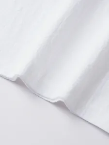 Close-up macro view of breathable white linen fabric texture and fine stitching detail