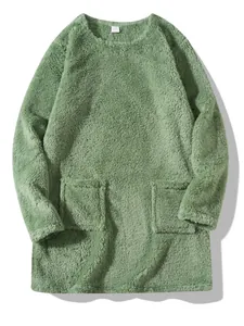 Detailed view of soft green plush fleece sweatshirt featuring double front pockets