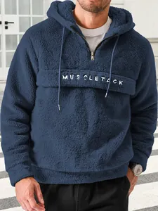 Cozy men's navy blue plush fleece hoodie featuring quarter-zip and white MUSCLE TACK embroidery