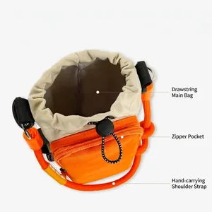 Detail view of outdoor bottle bag with drawstring main pocket and front zipper pocket.
