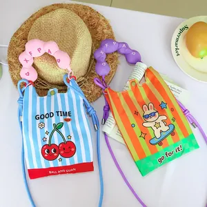 Detail of vibrant cartoon crossbody bags with padded handles and cute graphics