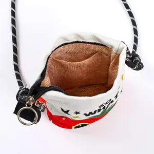 Interior detail showing the inner pocket and woven lining of a cartoon printed canvas bucket bag
