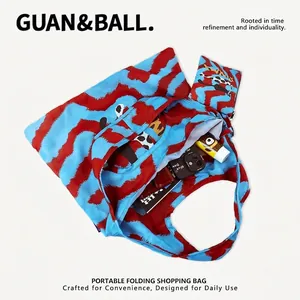 Detailed inside view of colorful folding shopping bag showing large capacity for essentials
