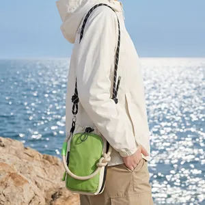 Outdoor casual crossbody phone bag in vibrant green with thick rope strap detail