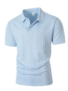 Detail shot of light blue polo shirt with intricate cable-knit jacquard texture.
