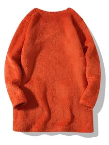 Detailed macro view of vibrant orange fluffy fleece texture on a loose sweatshirt