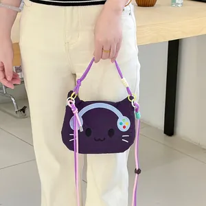 Detail shot of a cute purple cartoon cat crossbody bag featuring colorful dopamine straps