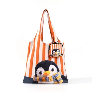Sac fourre-tout à rayures oranges avec motif pingouin et petite pochette assortie