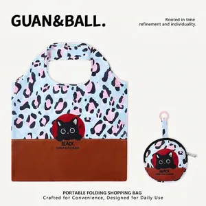 Portable foldable shopping bag featuring leopard print and cute black cat illustration