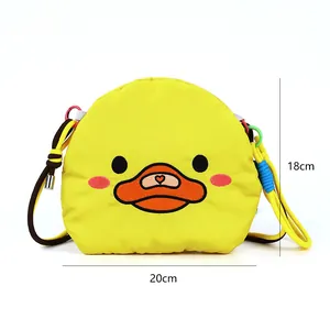 Detailed view of yellow cartoon duck crossbody bag showing dimensions 20cm by 18cm