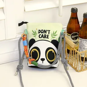 Cartoon panda canvas bucket bag with woven rope strap shown in lifestyle setting