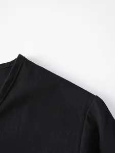 Detail view showing the breathable linen fabric texture and shoulder stitching of the black top