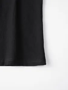 Close-up of the double-stitched hem on a breathable black linen casual shirt for men