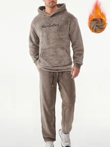 Close-up of warm men's fuzzy hoodie and pants set featuring Muscleattack embroidery