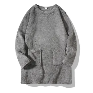 Detail view of gray plush long-sleeved fleece sweatshirt with round neck and pockets.