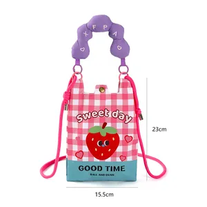 Macro detail of cartoon strawberry mini crossbody phone bag showing dimensions