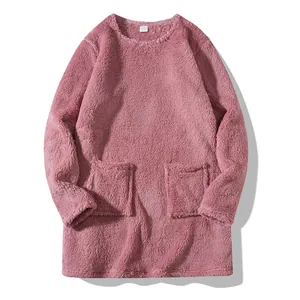 Close-up showing the soft plush texture of the pink round-neck long-sleeve sweatshirt.