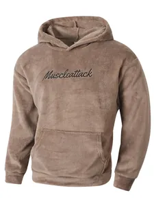 Close-up view of a men's fuzzy brown fleece hoodie with black Muscleattack embroidery detail