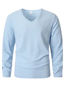Close-up view showing the light blue linen fabric texture of a men's V-neck shirt