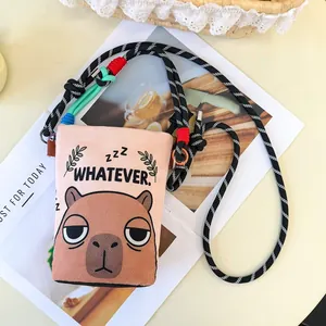 Detailed view of cute cartoon capybara print crossbody bag with colorful rope strap