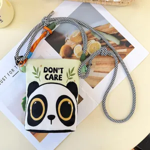 Detailed view of a cute cartoon panda print crossbody bag with a woven shoulder strap