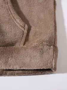 Close-up detail of soft brown fuzzy fleece texture on a warm men's loungewear set