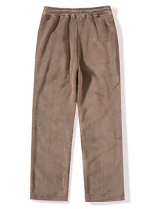 Detailed close-up view of plush solid color brown fleece trousers for the autumn winter season