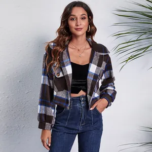 Close-up of stylish plaid cropped woolen jacket with lantern sleeves for women