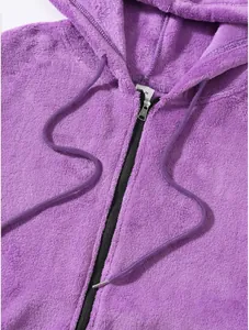 Close-up detail of purple fleece zip-up hoodie with drawstring and soft texture