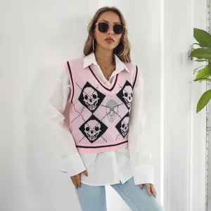 Pink Y2K skull pattern argyle knitted sweater vest worn over a crisp white long sleeve shirt