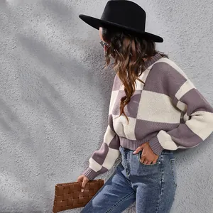 Chic purple and white checkerboard knit sweater shown in a stylish lifestyle setting