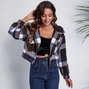 Stylish plaid cropped jacket with lantern sleeves and doll collar on a female model.