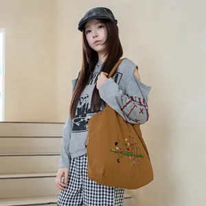 Casual Japanese style embroidered drawstring canvas tote bag for women in brown finish