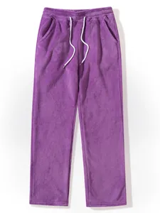 Close-up of soft purple fleece trousers with white drawstring and pockets