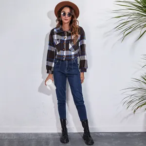Full length view of a woman wearing a plaid lantern sleeve wool jacket with doll collar