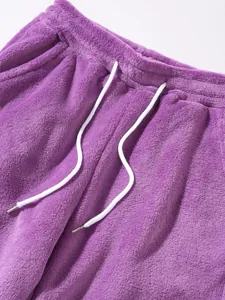 Detailed close-up showing the soft purple fleece texture and adjustable white drawstring waist