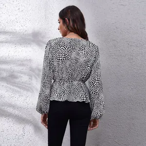 Back view of heart print chiffon blouse with cinched waist and lantern sleeves.