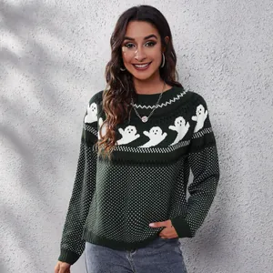 Detailed close-up view of a green knit sweater featuring white ghost jacquard patterns